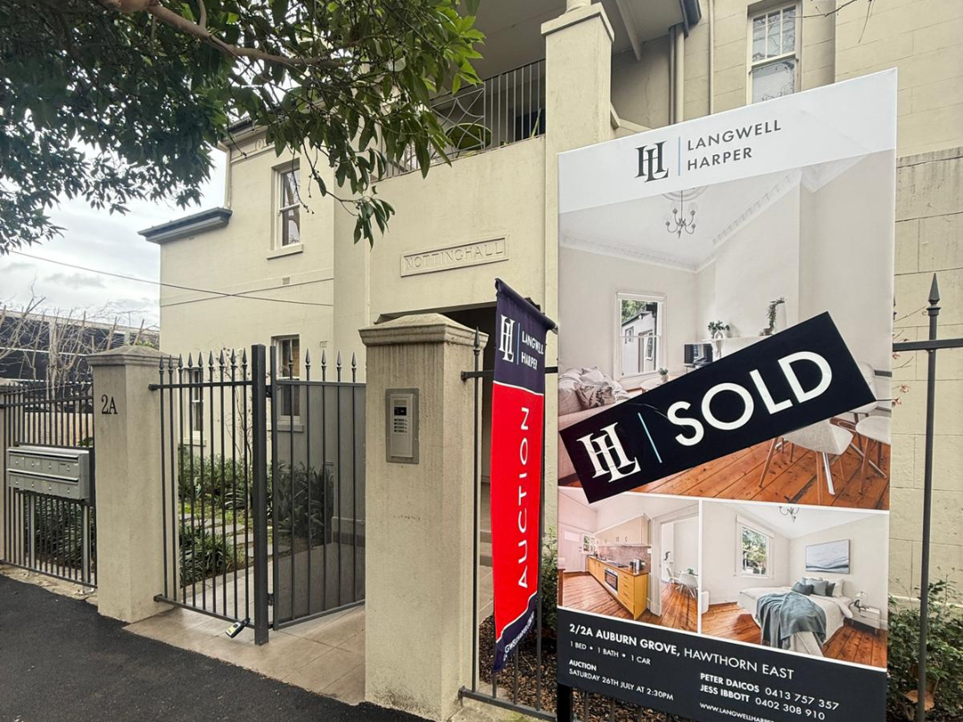 real estate board in Hawthorn East with a sold sticker on it from the Agency Langwell Harper located in Kew
