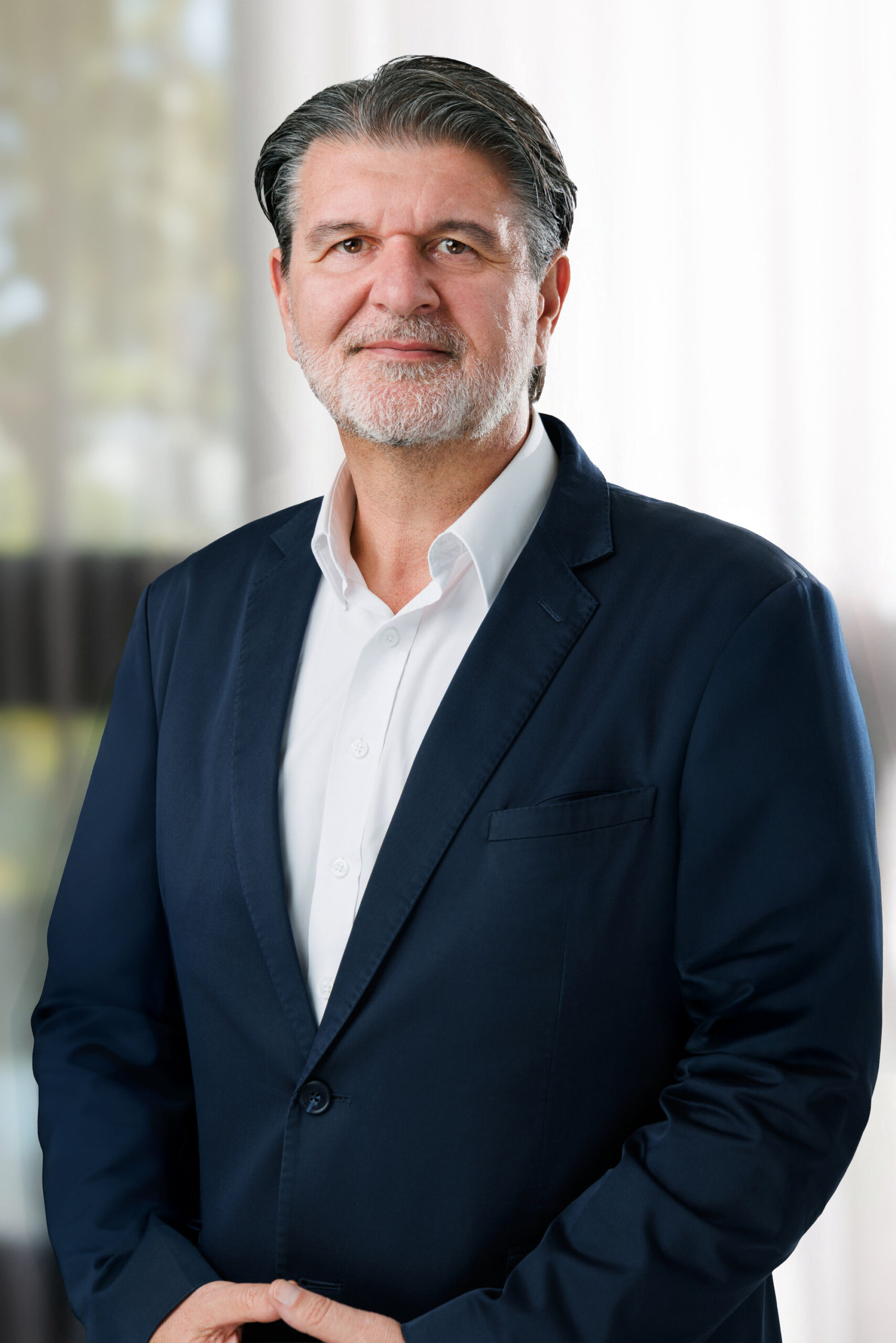 Corporate real estate photo of an agent in a navy blazer