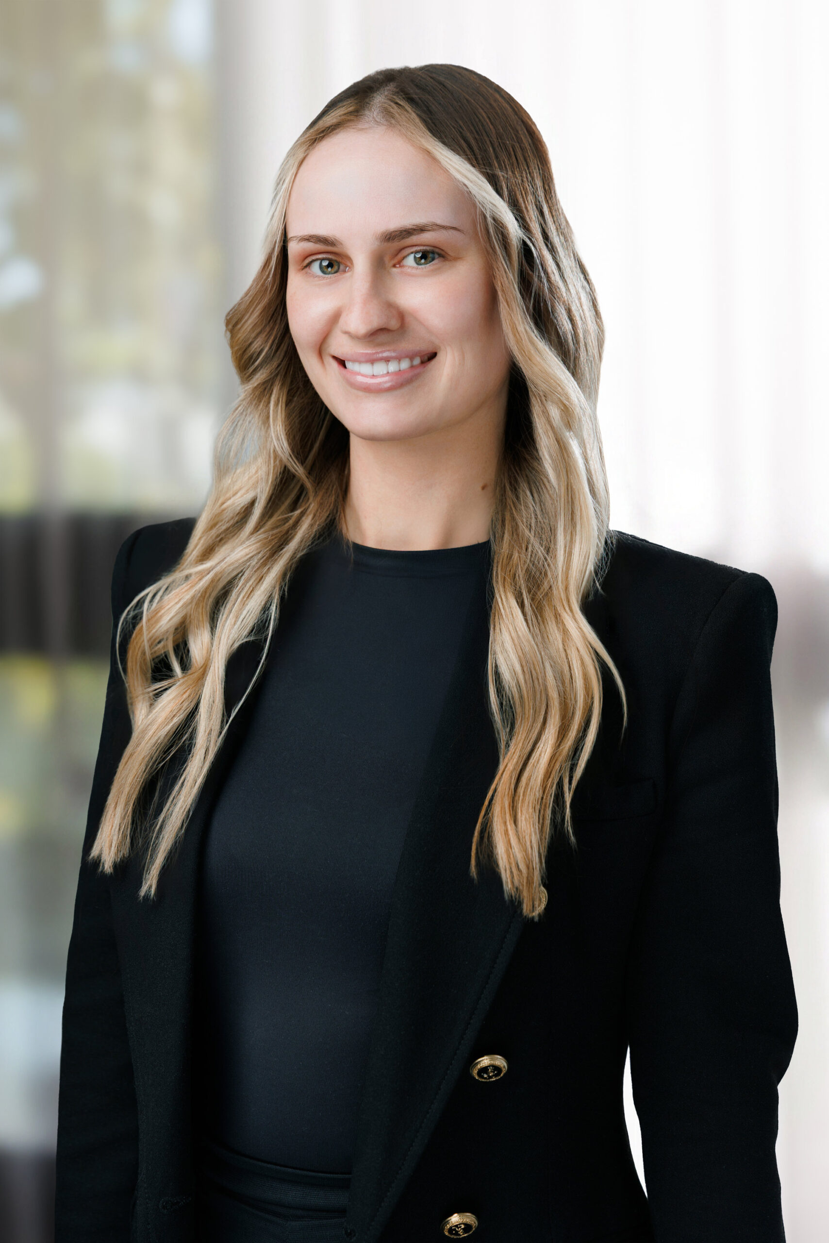 Corporate real estate photo of an agent in a black blazer