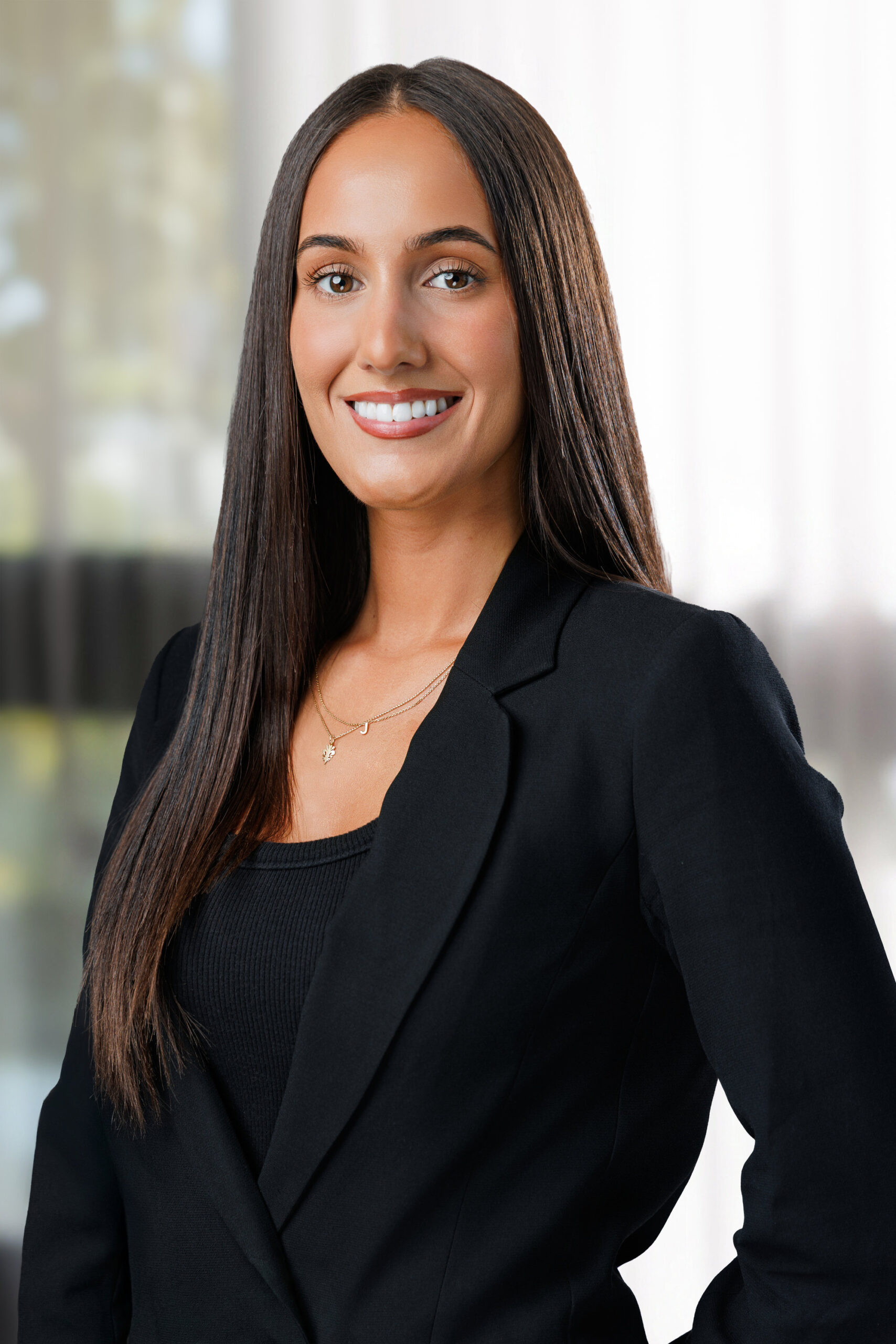 Corporate real estate photo of an agent in a black blazer