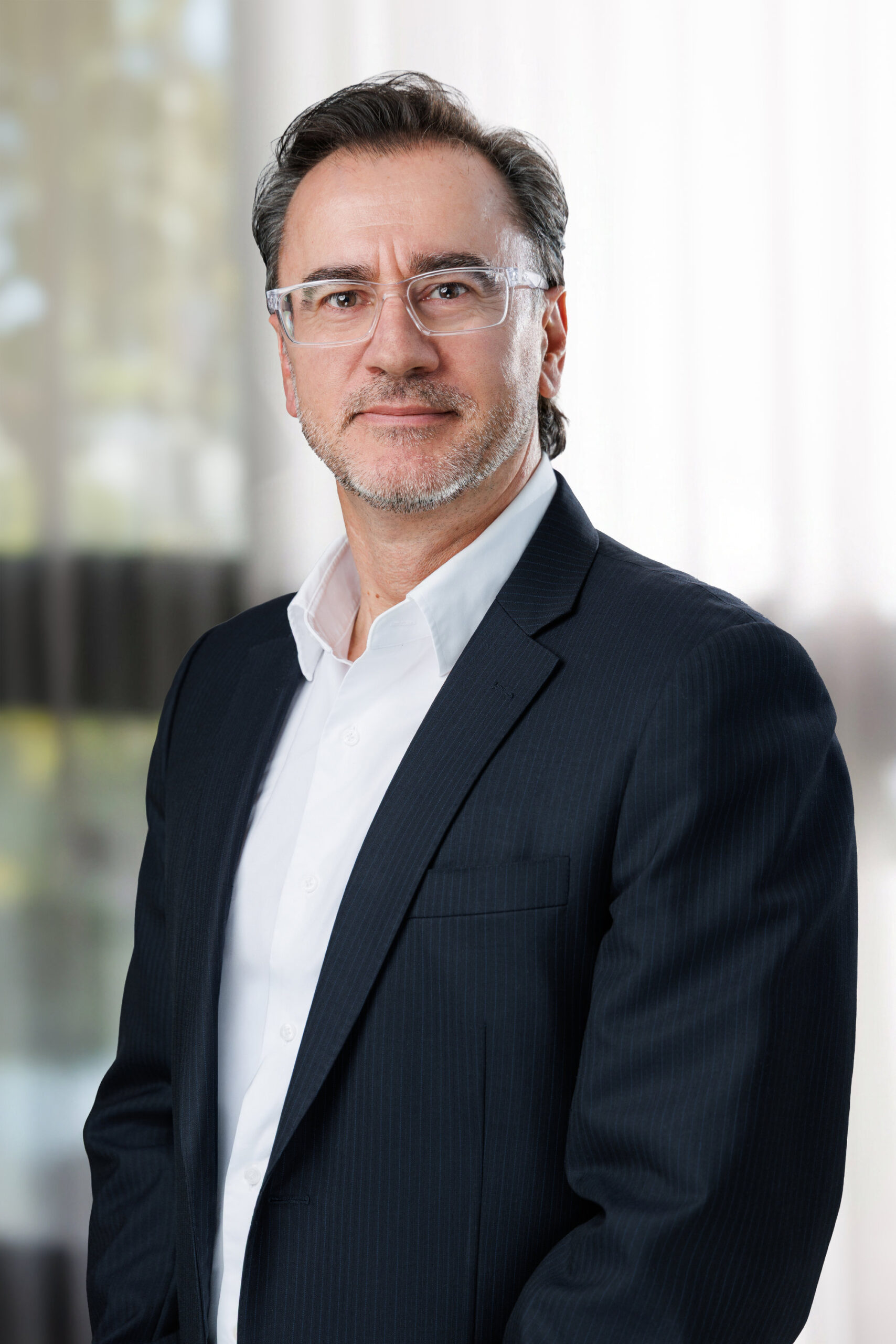 Corporate real estate photo of an agent in a navy blazer