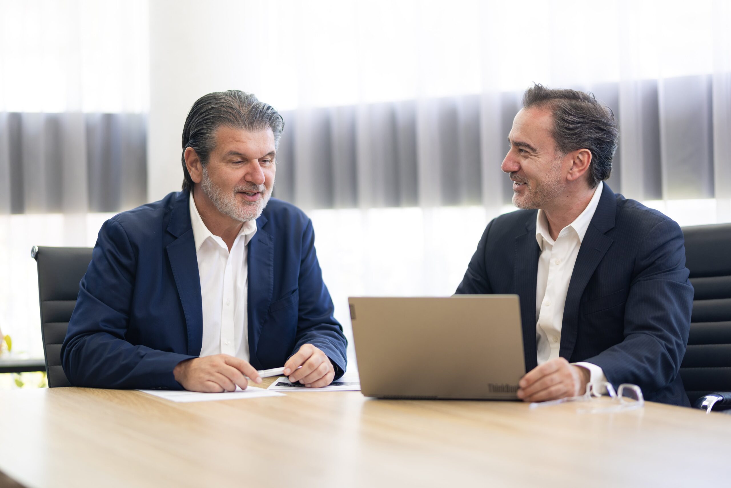 Peter Daicos and Arthur Korf from Langwell Harper Real Estate Agency having a meeting.